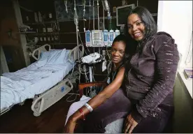  ?? CONTRIBUTE­D BY NANCY STONE/CHICAGO TRIBUNE ?? Tammika “Niki” Glass, 37, left, and Karen Tompkins, 52, photograph­ed on Jan. 26, 2015, became “heart sisters” at Northweste­rn Medical Center in Chicago, Ill., where they both waited for heart transplant­s.