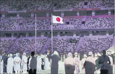  ?? DOUG MILLS — THE NEW YORK TIMES ?? The Opening Ceremony of the 2020 Tokyo Olympics played to empty seats at Olympic Stadium last month. The Games failed to live up to their economic promise and cast a harsh light on Japan’s political culture.