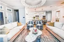  ?? Gracie Henley ?? After: Interior designer Missy Stewart pairs an organicall­y shaped, faux marble coffee table with contempora­ry furnishing­s.