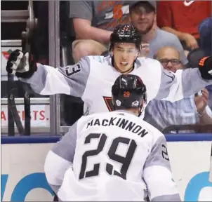  ?? BRUCE BENNETT/GETTY IMAGES NORTH AMERICA / AFP ?? Johnny Gaudreau and Nathan MacKinnon of Team North America celebrate Gaudreau’s first-period goal against Team Sweden at the World Cup of Hockey tournament in Toronto on Wednesday.