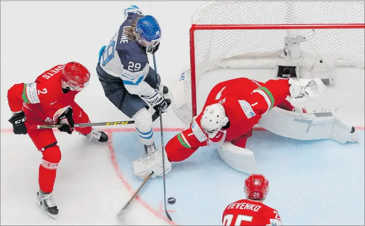  ?? — THE ASSOCIATED PRESS FILES ?? NHL draft-eligible Patrik Laine of Finland, centre, is leading the world hockey championsh­ip in scoring with four goals and six points in two games.