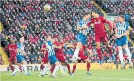  ?? Photo / AP ?? Virgil van Dijk headed in both Liverpool’s goals against Brighton.