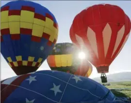  ?? ERIC GAY — THE ASSOCIATED PRESS ?? Balloons launch Sunday from a field at sunrise during the Balloons Over Angel Fire festival in Angel Fire, New Mexico. About 40 hot-air balloons fill the skies each day of the three-day festival over Father’s Day weekend.