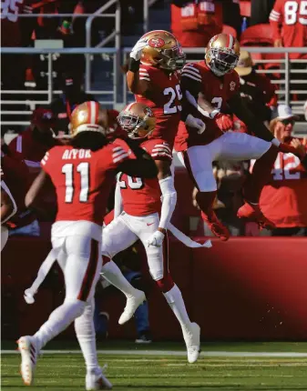  ?? Photos by Carlos Avila Gonzalez / The Chronicle ?? Safeties Talanoa Hufanga (29) and Jaquiski Tartt (3) celebrate Tartt breaking up a Falcons pass on 4th-and-goal in the first half as the 49ers made several big defensive stands in the game.