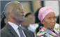  ??  ?? SADDENED: Former president Thabo Mbeki and his wife Zanele Mbeki look on during the memorial service for Dr Zola Skweyiya