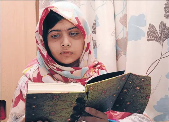  ?? Photos: REUTERS ?? Recovering: Malala Yousufzai recuperate­s in hospital in Birmingham, England, a month after she was shot in the head by Taliban gunmen in the Swat Valley in Pakistan because of her support for education for girls.