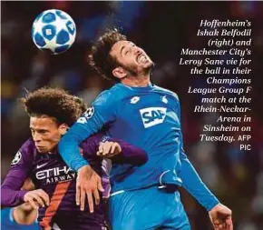  ?? AFP PIC ?? Hoffenheim’s Ishak Belfodil (right) and Manchester City’s Leroy Sane vie for the ball in their Champions League Group F match at the Rhein-NeckarAren­a in Sinsheim on Tuesday.