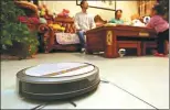  ?? PROVIDED TO CHINA DAILY ?? A sweeper robot cleans home in Xi’an, Shaanxi province, in 2017.