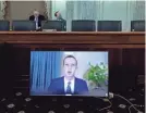  ?? MICHAEL REYNOLDS/AP ?? Facebook CEO Mark Zuckerberg appears on a screen as he speaks remotely during a hearing before the Senate Commerce Committee on Capitol Hill on Wednesday.