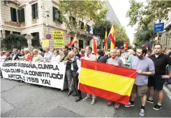  ??  ?? People rally during a demonstrat­ion organised by the Spanish right-wing party Vox in front of the Spain Government Delegation in Barcelona, in this Sept. 6 photo. (AFP)