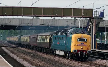  ??  ?? BELOW: With the Deltic Preservati­on
Society’s Class 55 D9009 Alycidon still side-lined for repairs, it is welcome news
that Locomotive Services’ 55022 Royal Scots Grey is to return
to the main line this year. During its previous stint with Martin Walker, the thoroughbr­ed blasts through Arlesey on June 2, 2012 with ‘The York Flyer’
charter. (Wikimedia Commons/Roger
Carvell)