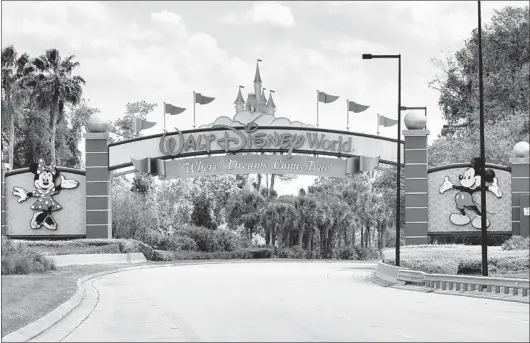  ?? JOE BURBANK/TNS ?? An empty entrance to Walt Disney World on March 24. The NBA is using the ESPN Wide World of Sports Complex at Disney World as a venue to complete the season.