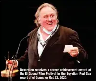  ?? ?? Depardieu receives a career achievemen­t award at the El Gouna Film Festival in the Egyptian Red Sea resort of el Gouna on Oct 23, 2020.