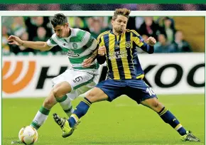  ??  ?? STAYING STRONG: Bitton battles with Diego during the 2-2 Celtic Park draw