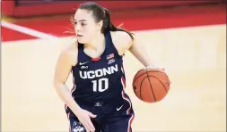  ?? Kathy Willens / Associated Press ?? UConn guard Nika Muhl dribbles against St. John’s on Wednesday in New York.