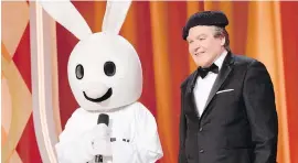  ?? ABC ?? Mike Myers as British comedian Tommy Maitland and Snax the Funny Bunny on The Gong Show.