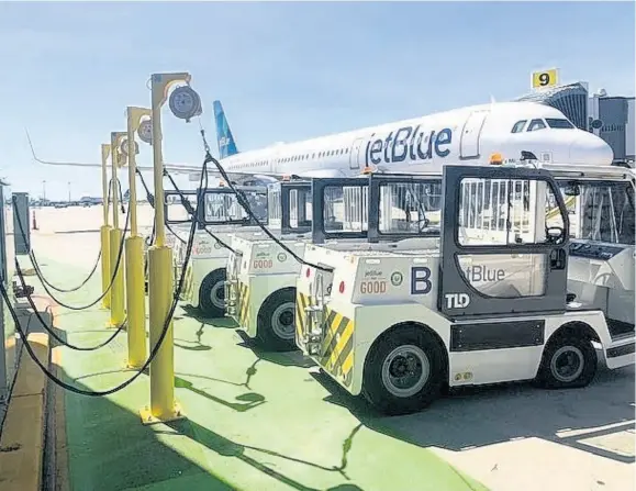  ??  ?? JetBlue introduces the largest electric ground service equipment (eGSE) fleet at New York’s JFK Internatio­nal Airport, cutting four million pounds of greenhouse gas emissions per year.