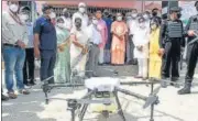  ?? HT PHOTO ?? CM Yogi Adityanath inspecting a drone that would be used to keep a tab on cleanlines­s at the ghats, in Varanasi.