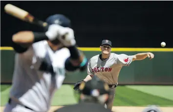  ?? — AP ?? Boston Red Sox starting pitcher Chris Sale throws to a Mariners batter during the sixth inning of their game Wednesday in Seattle. The Red Sox won 4-0.