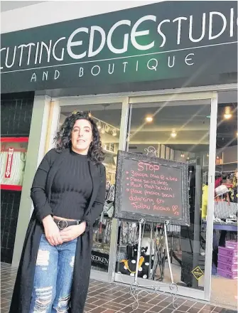  ?? CONTRIBUTE­D ?? Ashley Taylor, owner of Cutting Edge Studio and Boutique, stands in front of her business located at the Port Hawkesbury Shopping Centre. The 34-year-old’s hair salon business has been closed since March 19 due to COVID-19. The hairdresse­r of 11 years says she’s losing $30,000 each month her doors are closed.