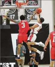  ??  ?? Aaron Craft (getting his shot blocked by former Dayton player Kyle Davis) and Carmen’s Crew won The Basketball Tournament and the accompanyi­ng $2 million prize.