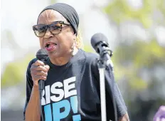  ?? TELECHAN/POST-TRIBUNE ?? The Rev. Dena Holland-Neal of the United Church of Christ in Gary, daughter of longtime Gary Deputy Mayor James Holland, speaks during a Hammond rally in protest of ICE raids, deportatio­ns and detention camps on July 20, 2019. KYLE