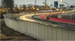  ??  ?? This photo taken on Feb 2, 2017 shows a four-metre-high wall running along a kilometre-long stretch of the main road leading to Calais port, aimed at stopping migrants who attempt to reach its shores.