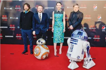  ??  ?? (Left-Right) Israeli film producer Ram Bergman, US film director Rian Johnson, British actress Daisy Ridley, US actor Mark Hamill pose at the red carpet for the Chinese premiere of ‘Star Wars:The Last Jedi’ at the Shanghai Disney Resort in Shanghai on...