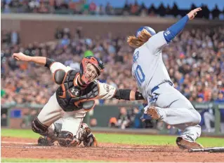  ?? JOHN HEFTI, USA TODAY SPORTS ?? Giants catcher Buster Posey, left, is batting .378 this year but has driven in only 11 runs.