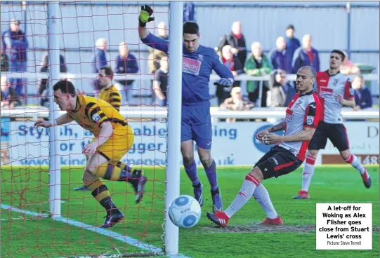  ?? Picture: Steve Terrell ?? A let-off for Woking as Alex Flisher goes close from Stuart Lewis’ cross