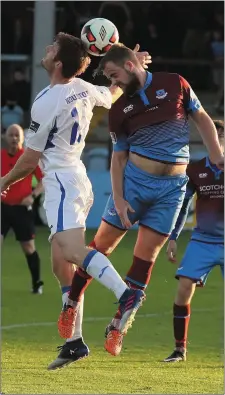  ??  ?? Sean Houston of Finn Harps and Ryan McEvoy of Drogheda United get their heads to the ball.