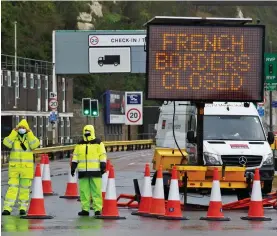  ??  ?? No entry: Officials man a roadblock at the port yesterday