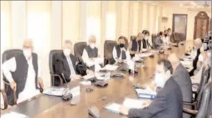  ??  ?? ISLAMABAD
Federal Minister for Finance and Revenue, Shaukat Tarin, chairing a meeting of the National Price Monitoring Committee at the Finance Division to review the price trend of essential items. -APP