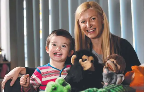  ?? Picture: REGI VARGHESE ?? Lisa Douglas – pictured with her son Riley, then 3, in 2014 – is suing his former school, St Stephen’s College at Coomera.