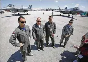  ?? TY GREENLEES / STAFF ?? U.S. Air Force F-35 Lightning II crew members were interviewe­d after their arrival for the Vectren Dayton Air Show. From the left are Lt. Col. Brad Bashore, Lt. Col. Brett Robison, Lt. Col. Scott Charlton, and Master Sgt. Rebecca Moore.