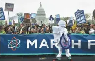  ?? YIN BOGU / XINHUA ?? Protesters take part in the March for Science in Washington, US, on Saturday. Similar events were held in other US cities and across the world.