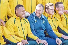  ?? — AFP photo ?? Australian Wallabies rugby player Samu Kerevi (L) share a lighter moment with coach Micheal Cheika (2/L) as teammates look on during the Captain's Run in Sydney on August 18, 2017.