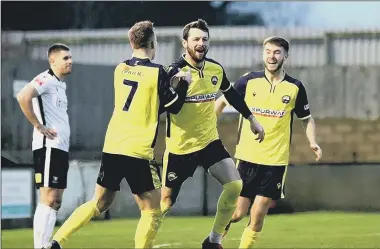  ?? Picture: Tom Phillips ?? GOALDEN START TO 2022 Dan Wooden, middle, celebrates one of his three goals in Gosport’s stunning 5-0 win at Salisbury