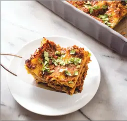  ?? Associated Press photo ?? This undated photo provided by America’s Test Kitchen in August shows a lasagna with ragu alla Bolognese in Brookline, Mass. This recipe appears in the cookbook “Just Add Sauce.”