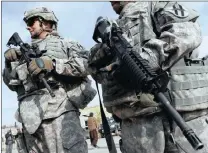  ?? PICTURE: AP ?? American soldiers stand guard in Kabul.
