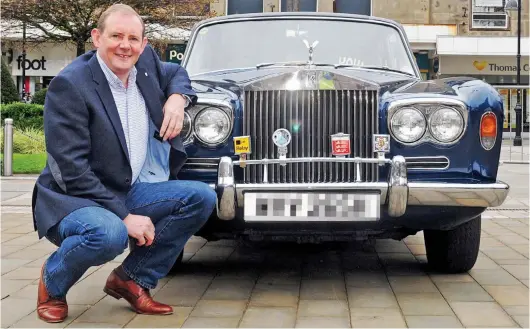  ??  ?? Luxury lifestyle: George Holmes, vice-chancellor of Bolton University, posing with his late father’s Rolls-Royce