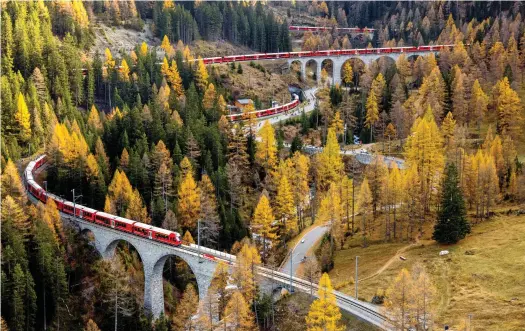  ?? PHILIPP SCHMIDLI. ?? An aerial photo of the world record attempt, with the longest passenger train negotiatin­g the spiral tunnels and viaducts of the Rhaetian Railway’s Albula UNESCO World Heritage route in eastern Switzerlan­d on October 29.