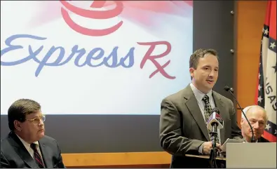  ?? Arkansas Democrat-Gazette/JOHN SYKES JR. ?? Galen Perkins, CEO of Express RX, talks about the company’s plans Monday at a news conference held at the Little Rock Regional Chamber of Commerce and attended by officials including chamber Chairman Kevin Crass (left) and Gov. Asa Hutchinson.