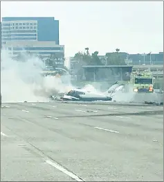  ??  ?? A small plane crashed on the 405 Freeway near John Wayne Airport in Orange County, California. — Reuters photo