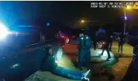  ?? — afp ?? A still image shows Tyre Nichols handcuffed on the ground surrounded by police officers in Memphis, Tennessee.