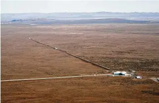  ?? Caltech/MIT/LIGO Lab / New York Times ?? Texas Tech’s Tom Maccarone, co-author of the latest study, and a global group of astronomer­s use radio telescopes like this one in Hanford, Wash., to seek answers about black holes.