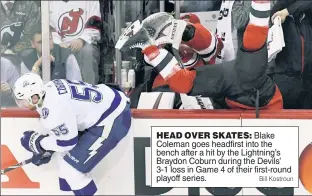  ?? Bill Kostroun ?? HEAD OVER SKATES: Blake Coleman goes headfirst into the bench after a hit by the Lightning’s Braydon Coburn during the Devils’ 3-1 loss in Game 4 of their first-round playoff series.