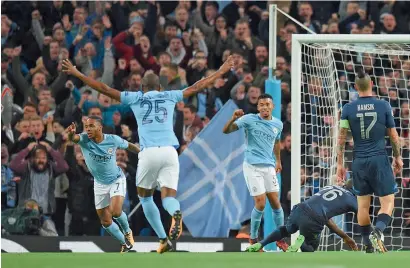  ?? AFP ?? City’s Sterling and teammates celebrate a goal against Napoli during a Champions League match at the Etihad Stadium. —