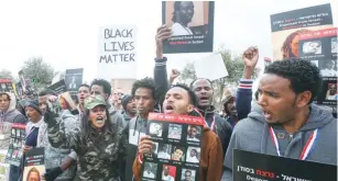  ?? (Marc Israel Sellem/The Jerusalem Post) ?? SUDANESE AND ERITREAN REFUGEES protest their treatment in front of the Knesset in January.