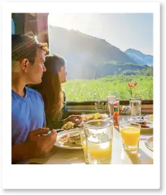  ??  ?? Tucking into breakfast, which includes reindeer sausages, on the Alaska Train.